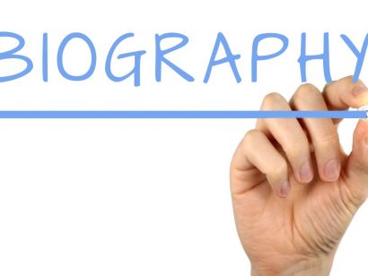 Hand drawing the word Biography with a marker